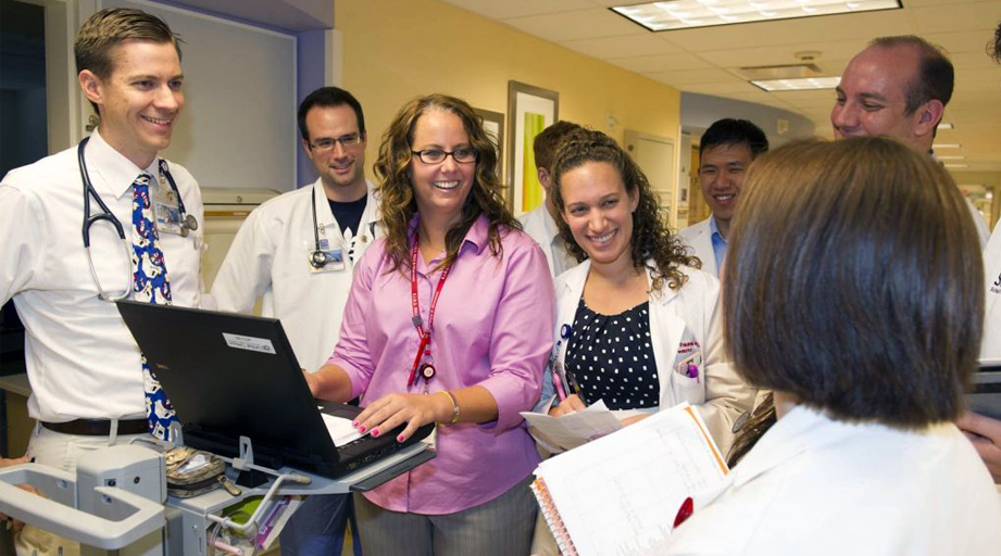 Lisa Lubsch, PharmD, doing rounds with student pharmacists