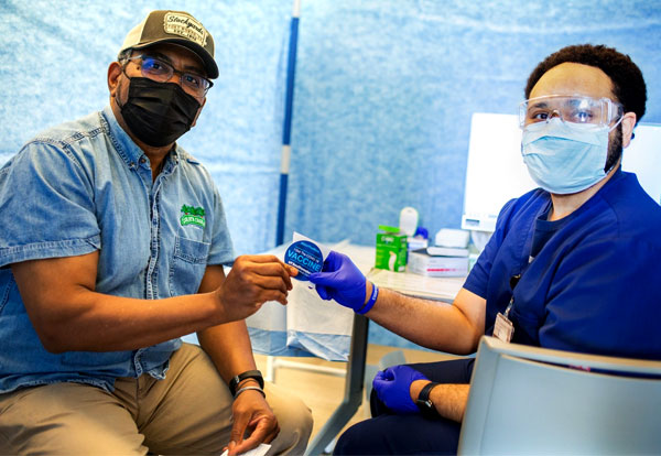 Joshua Blackwell, PharmD, MS, volunteers his time to help those in his community