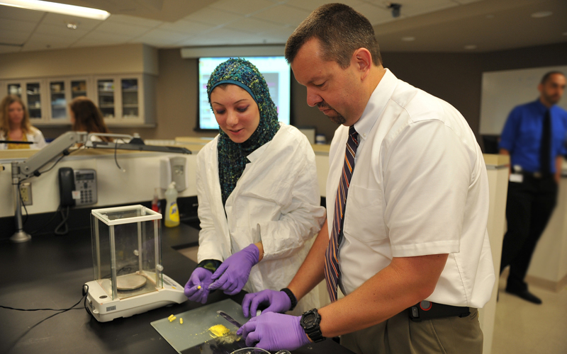 Dale English II works with a student