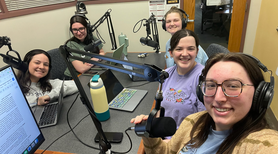 group of students conducting a podcast