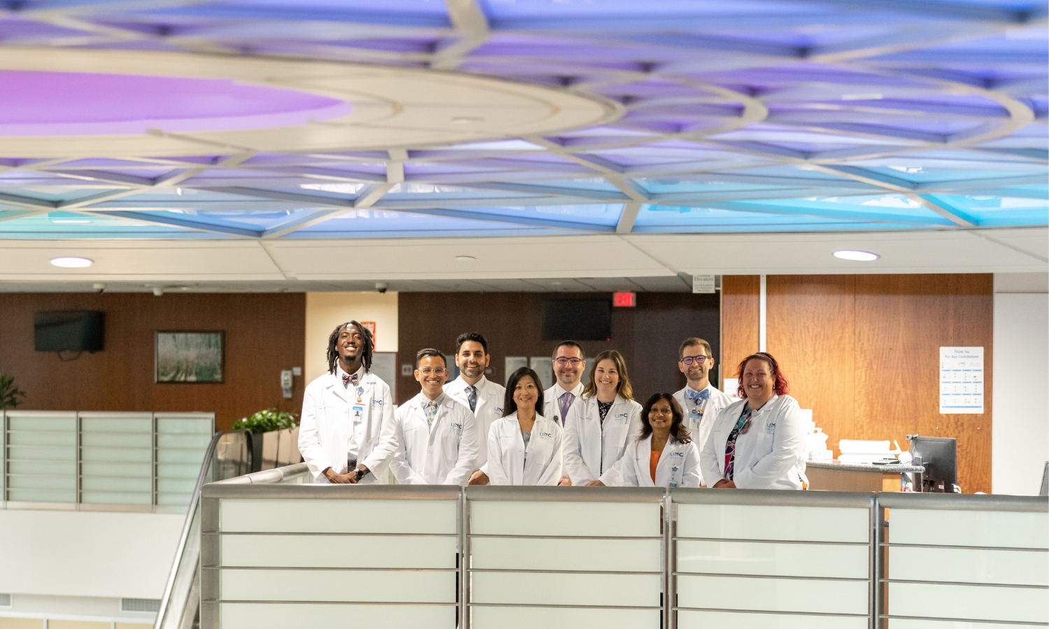 a group of health care providers happily standing together